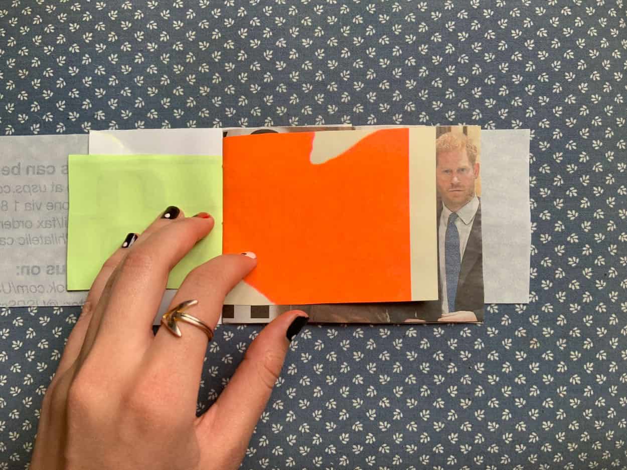 M_A_Charlotte_Zanna_Book_3 book open to pages of chartreuse colored paper and beige paper with bright orange blob.