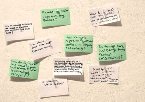 a closer image of green and white sticky notes. There is on all of them