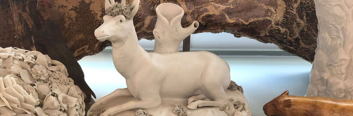 ceramic sculptures, including a sculpture of a deer.