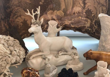 ceramic sculptures, including a sculpture of a deer.