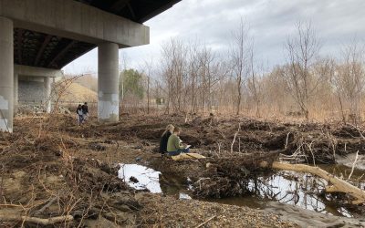 people sitting underneath overpass, drawing.